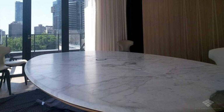 Patina finish on white marble table.